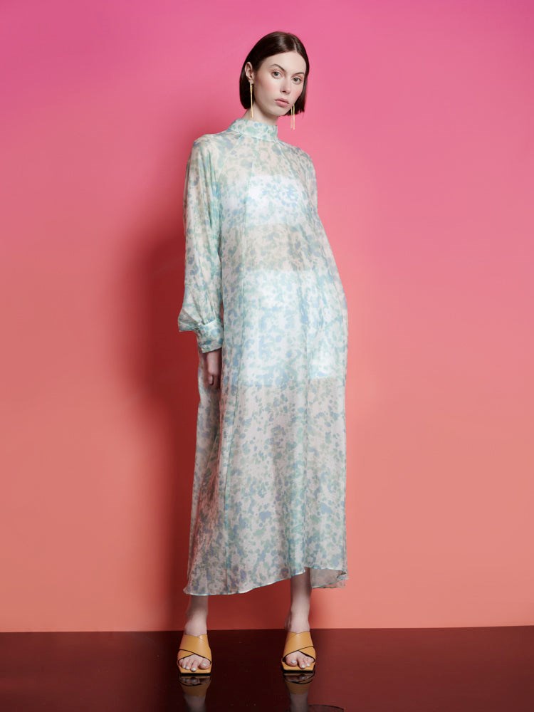 Ghospell Nina Printed Midi Dress brings a fresh twist to the classic trend. This oversized midi dress features a lightweight abstract printed fabric that exudes edgy sophistication. With its slightly sheer quality, it's perfect for layering or wearing solo, allowing you to embrace the season's breezy vibes with ease.